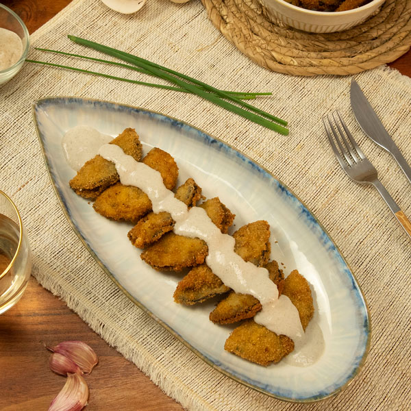 Empanadillas de berenjena con salsa de champiñones