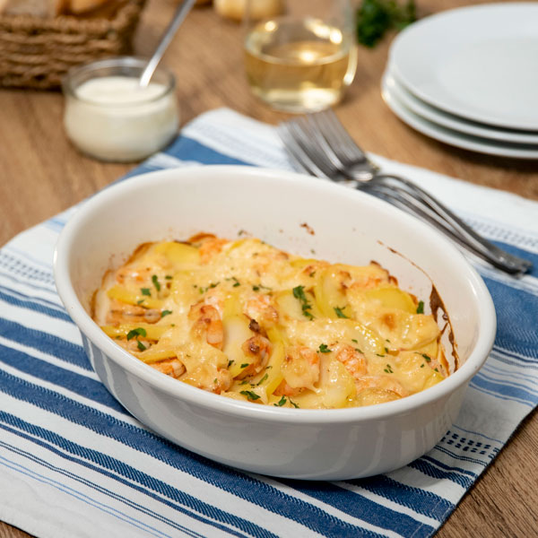 Patatas gratinadas con langostinos